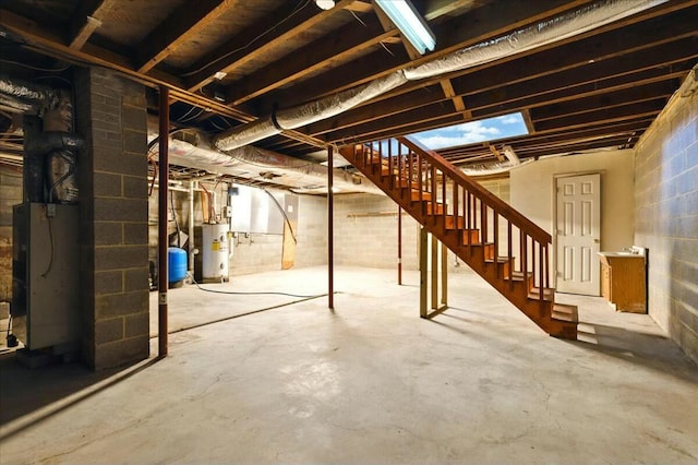 2351 Reese Mountain Rd, Elliston, VA 24087 - unfinished basement featuring water heater, concrete block wall, stairway, and heating unit