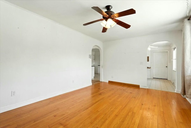2351 Reese Mountain Rd, Elliston, VA 24087 - spare room with ceiling fan, arched walkways, light wood finished floors, and baseboards