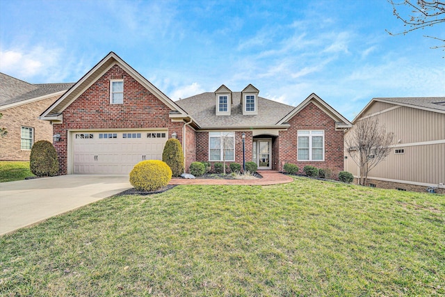 traditional-style home with a shingled roof, concrete driveway, an attached garage, a front lawn, and brick siding