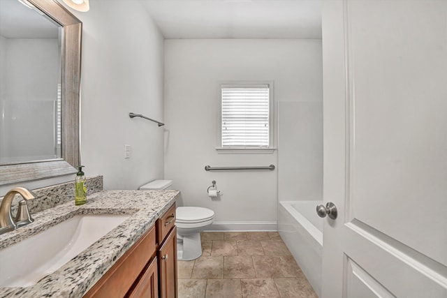 bathroom featuring toilet, vanity, a bath, baseboards, and tile patterned floors