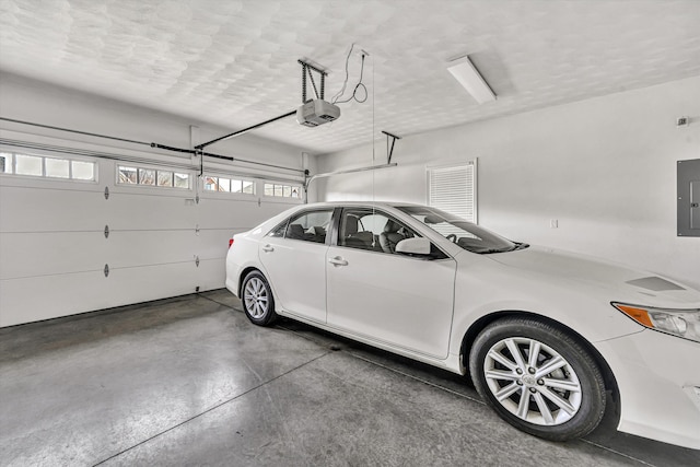 parking deck featuring a garage door opener and electric panel