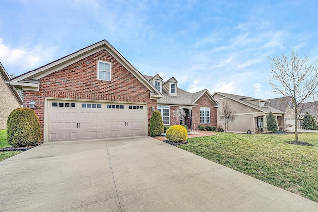 traditional home featuring a garage, driveway, brick siding, and a front yard