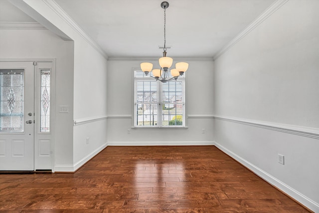 unfurnished dining area featuring a notable chandelier, visible vents, ornamental molding, wood finished floors, and baseboards