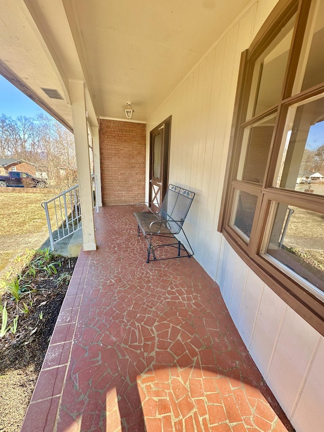 view of patio with a porch and visible vents