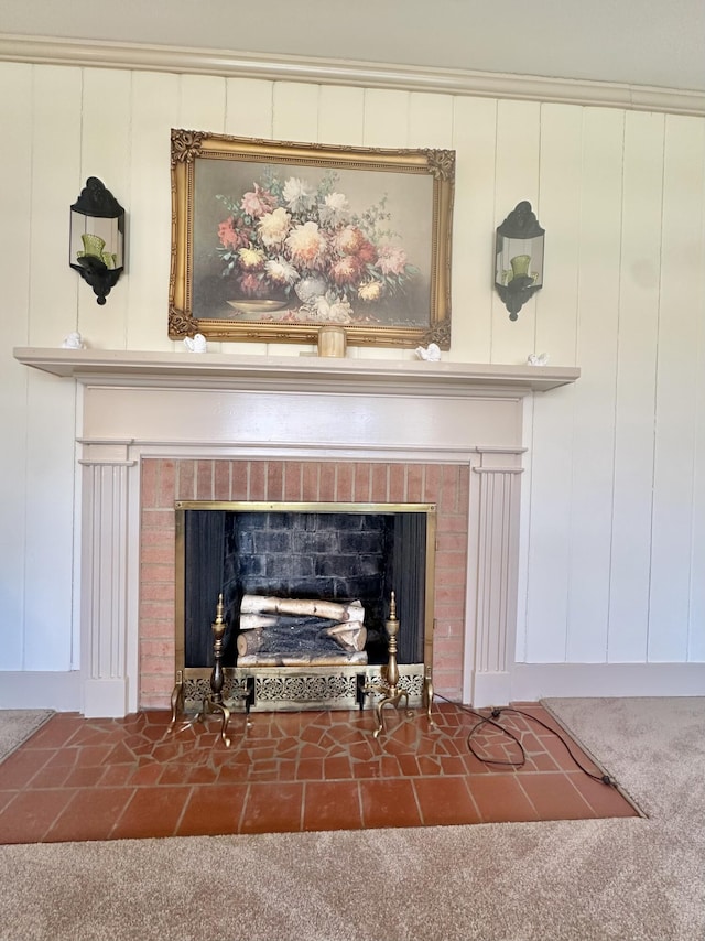 room details featuring a brick fireplace and carpet flooring