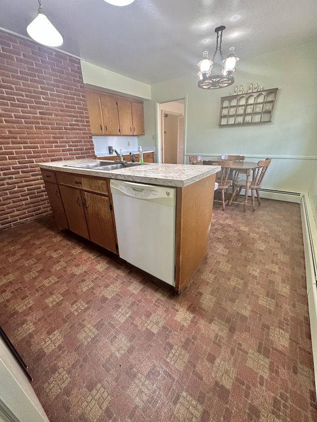 kitchen featuring dishwasher, brick wall, hanging light fixtures, light countertops, and a sink