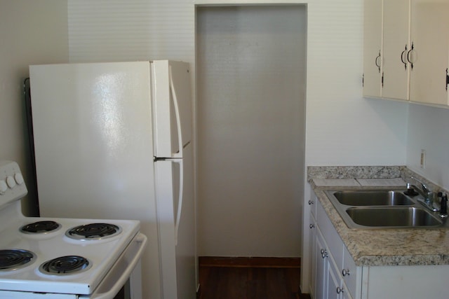 kitchen with white range with electric stovetop, light countertops, white cabinetry, a sink, and wood finished floors