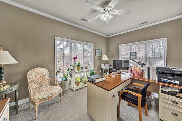 home office with visible vents, light colored carpet, ceiling fan, and crown molding