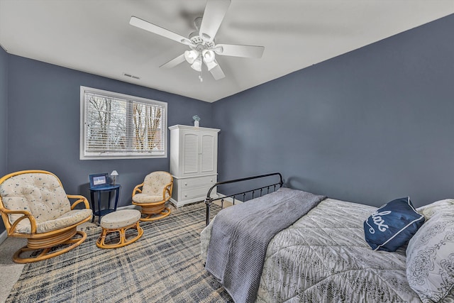 bedroom with visible vents, baseboards, carpet, and a ceiling fan