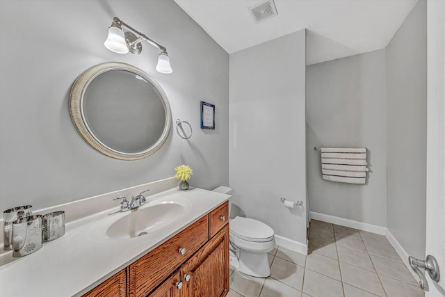 bathroom featuring tile patterned floors, visible vents, toilet, baseboards, and vanity