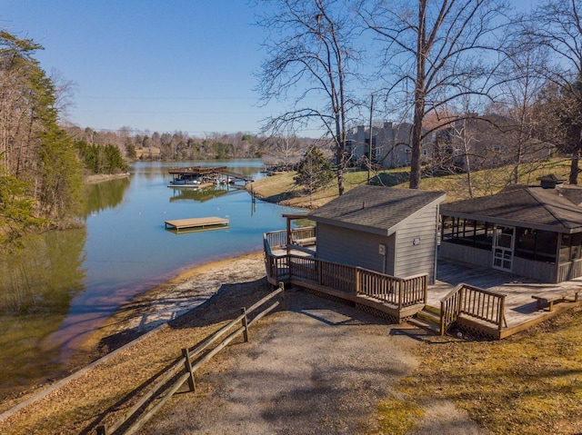 view of dock featuring a deck with water view