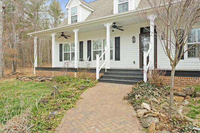 view of front of property featuring roof with shingles, a porch, and a ceiling fan