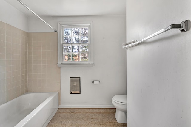 full bathroom with toilet, baseboards, and shower / bath combination