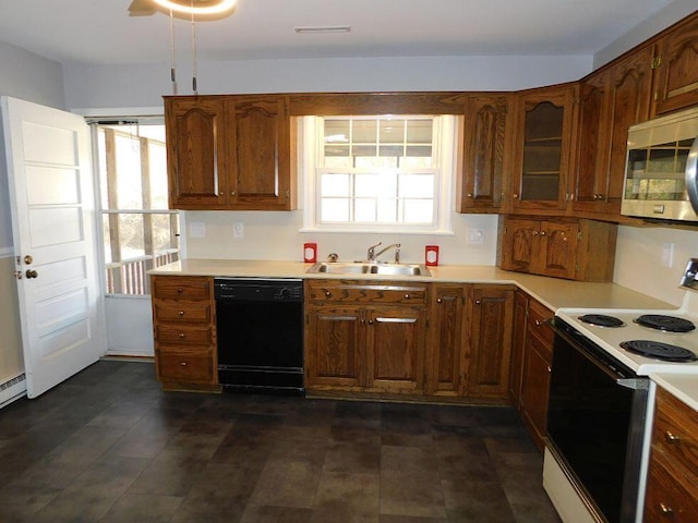 kitchen with dishwasher, electric stove, stainless steel microwave, light countertops, and a sink