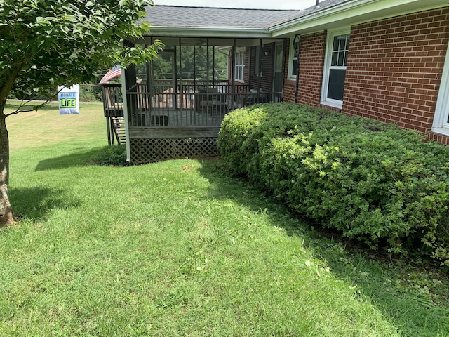 view of yard with a wooden deck