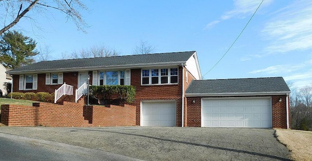 single story home featuring driveway and brick siding