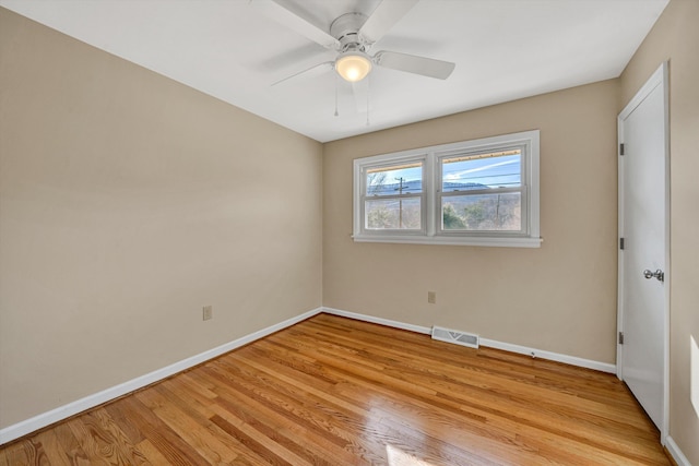 unfurnished bedroom with light wood-style floors, baseboards, visible vents, and ceiling fan