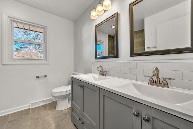 full bath with double vanity, visible vents, backsplash, and a sink