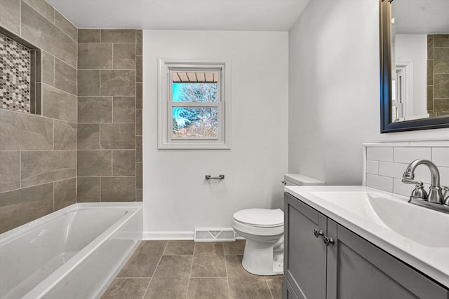 bathroom with baseboards, visible vents, toilet, vanity, and backsplash