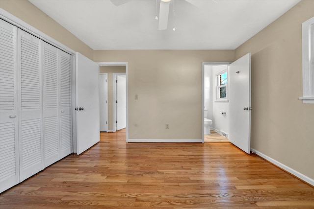 unfurnished bedroom with a ceiling fan, a closet, light wood-style flooring, and baseboards