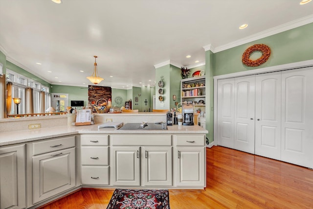 368 Penninsula Pt, Lynch Station, VA 24571 - kitchen featuring light countertops, crown molding, light wood finished floors, recessed lighting, and pendant lighting