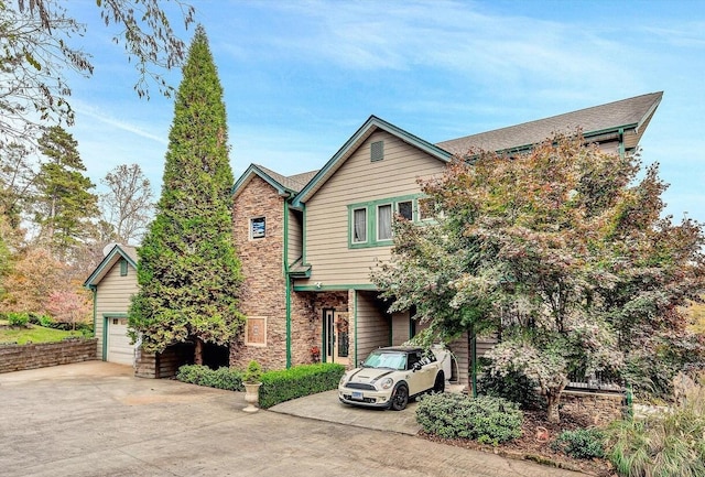 368 Penninsula Pt, Lynch Station, VA 24571 - view of front facade featuring concrete driveway, stone siding, and a garage