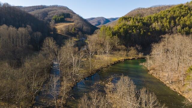 mountain view featuring a water view and a wooded view