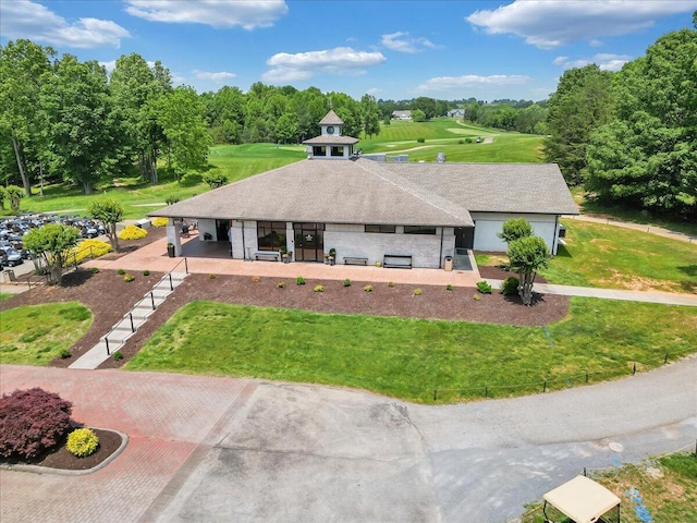 1273 Graves Harbor Trl Unit 3204, Huddleston, VA 24104 - view of front of property featuring a front lawn, view of wooded area, and a shingled roof