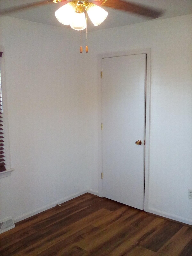 spare room featuring visible vents and wood finished floors