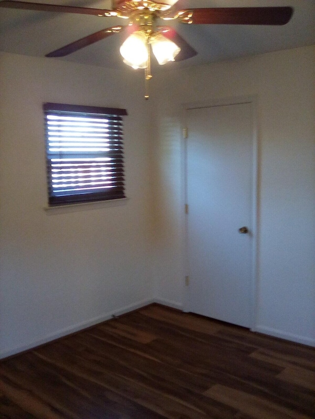 empty room featuring ceiling fan and wood finished floors