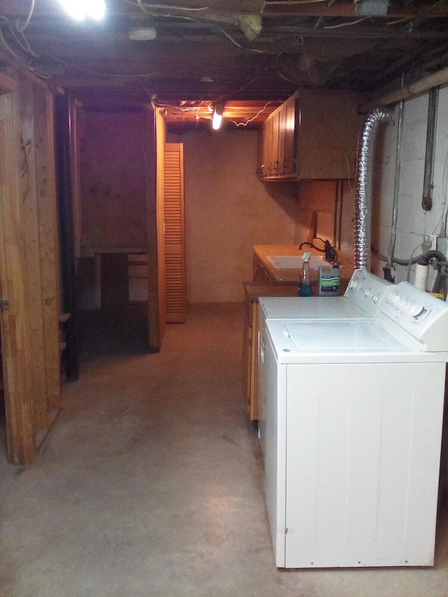 laundry area featuring laundry area, a sink, and independent washer and dryer