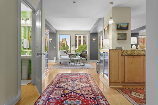 interior space with light wood finished floors and baseboards