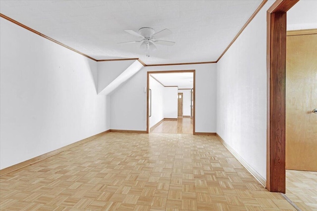 bonus room with ceiling fan and baseboards