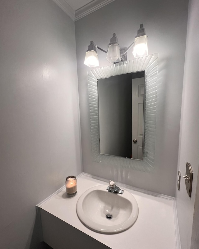 bathroom with vanity and crown molding