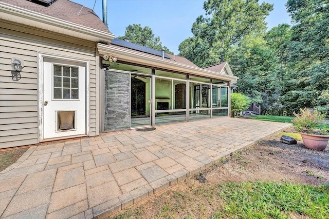 view of patio / terrace featuring a sunroom