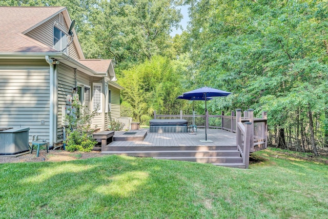 view of yard featuring a covered hot tub and a deck