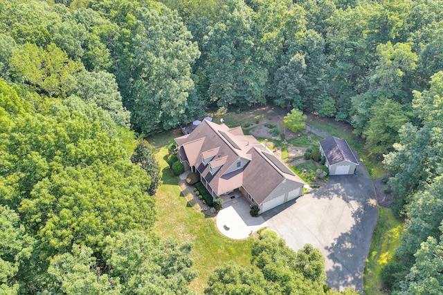 drone / aerial view featuring a forest view