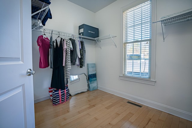 spacious closet with visible vents and light wood-style floors