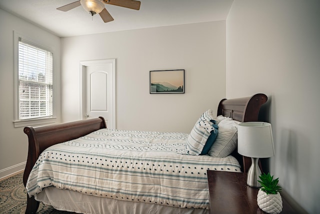 bedroom featuring a ceiling fan and baseboards