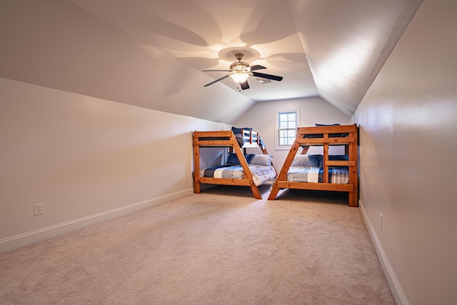 bedroom featuring lofted ceiling, ceiling fan, baseboards, and carpet flooring