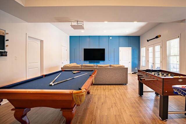 game room featuring baseboards, recessed lighting, and light wood-style floors