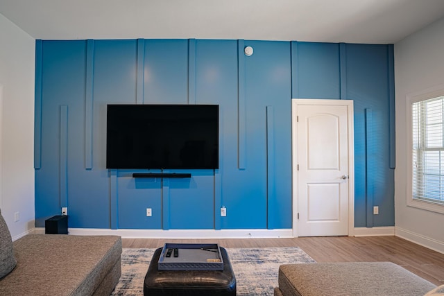 living room with baseboards and wood finished floors