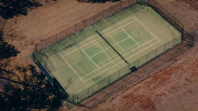 view of sport court featuring fence