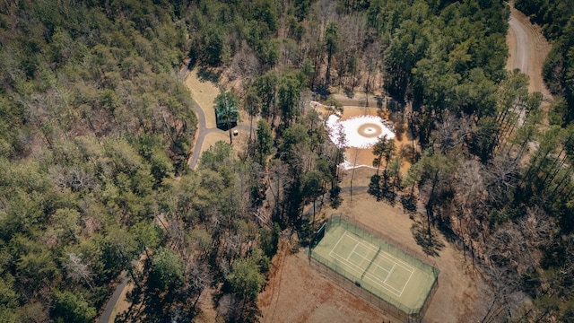 drone / aerial view with a wooded view