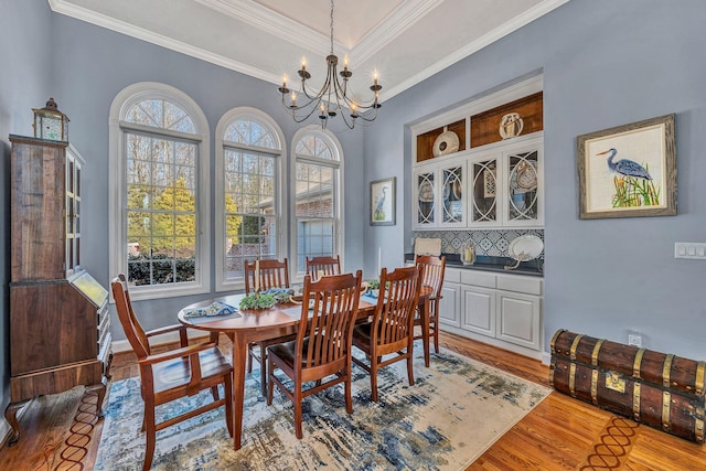 20 Waverly Ct, Moneta, VA 24121 - dining space with baseboards, a notable chandelier, wood finished floors, and ornamental molding
