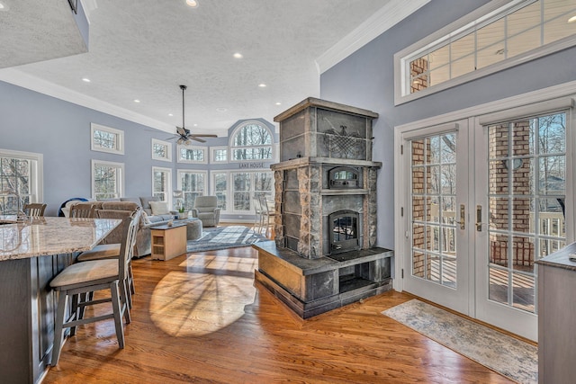 20 Waverly Ct, Moneta, VA 24121 - living room with ceiling fan, ornamental molding, a fireplace, wood finished floors, and a textured ceiling