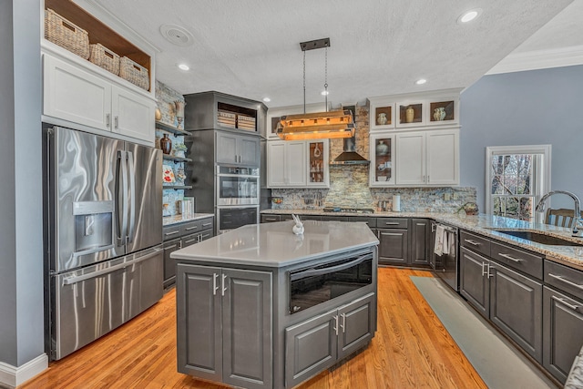 20 Waverly Ct, Moneta, VA 24121 - kitchen with open shelves, a sink, decorative backsplash, appliances with stainless steel finishes, and light wood-type flooring