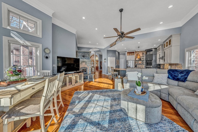 20 Waverly Ct, Moneta, VA 24121 - living area with arched walkways, wood finished floors, a ceiling fan, and ornamental molding