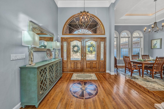 20 Waverly Ct, Moneta, VA 24121 - entrance foyer featuring ornamental molding, wood finished floors, and a chandelier