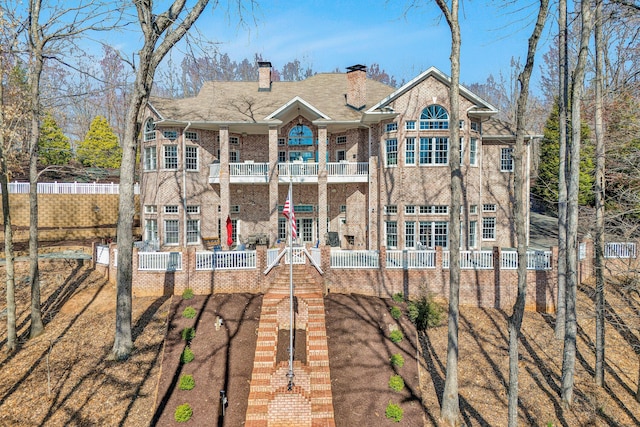 20 Waverly Ct, Moneta, VA 24121 - rear view of property featuring a fenced front yard, a chimney, and a balcony